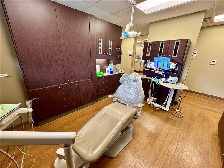A treatment room with a dental chair