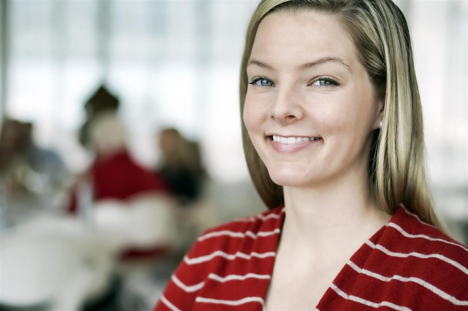 A woman smiling in a bright clinic